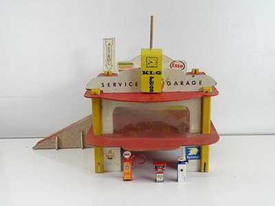 Lot 229 - A vintage 1960s/70s wooden built toy garage,...