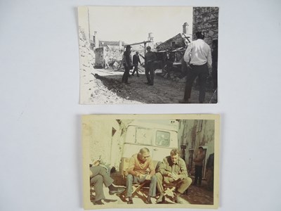 Lot 420 - KELLY'S HEROES - 2x photographs of Elliott...