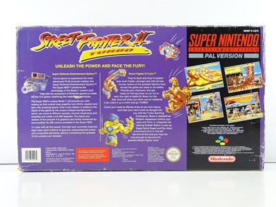 Lot 17 - Super Nintendo Entertainment System (SNES)...