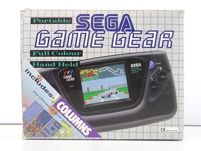Lot 66 - Portable Sega Game Gear console includes...