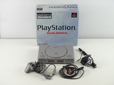 Lot 137 - Playstation original console including...