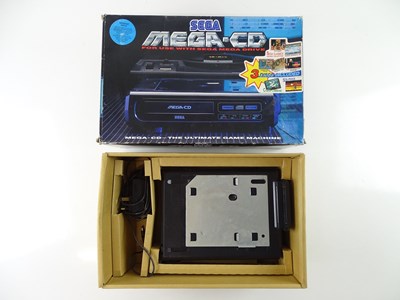 Lot 153 - Sega Mega-CD - an add on unit designed to be...