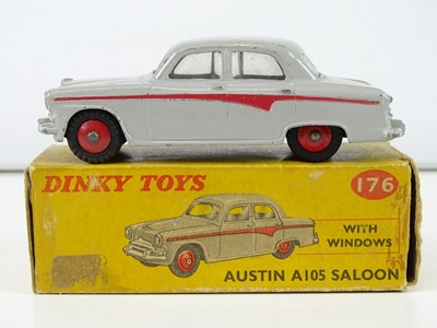 Lot 118 - A group of DINKY cars comprising a 152, 168...