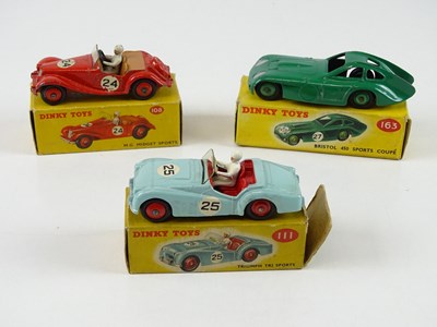 Lot 122 - A group of DINKY sports cars comprising a 108,...