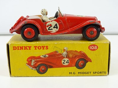 Lot 122 - A group of DINKY sports cars comprising a 108,...