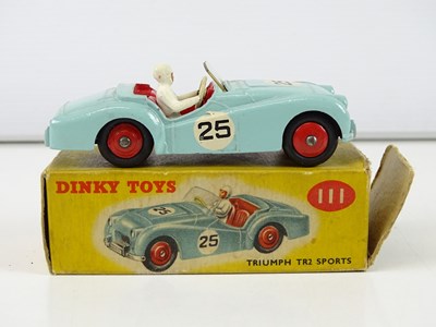 Lot 122 - A group of DINKY sports cars comprising a 108,...