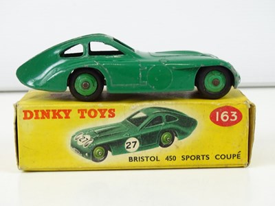 Lot 122 - A group of DINKY sports cars comprising a 108,...