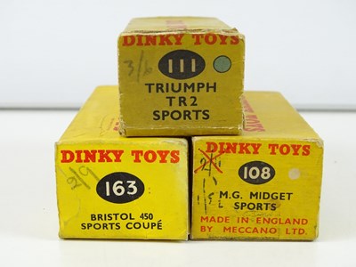 Lot 122 - A group of DINKY sports cars comprising a 108,...