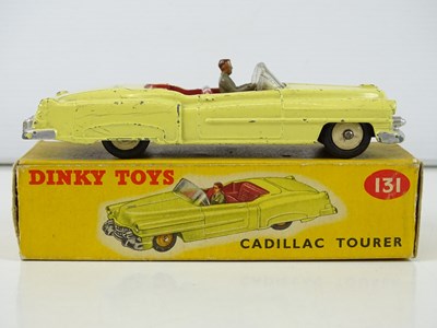 Lot 125 - A group of DINKY cars comprising a 131,167,...