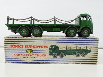 Lot 142 - A DINKY 905 Foden Flat Truck with chains in...