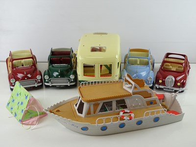 Lot 243 - A group of SYLVANIAN FAMILIES vehicles...