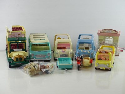 Lot 244 - A group of SYLVANIAN FAMILIES bus, vans,...