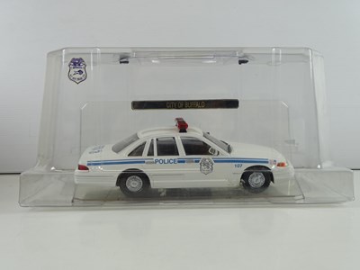 Lot 3 - A group of 1:64 and 1:43 scale police vehicles...