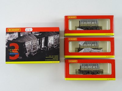 Lot 437 - A group of HORNBY OO Gauge wagons including a...