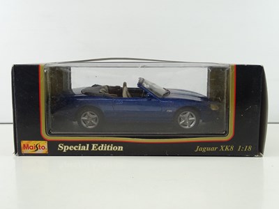 Lot 47 - A group of 1:18 scale diecast cars by MAISTO...