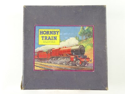 Lot 516 - A HORNBY O Gauge train set box containing four...