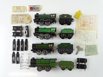 Lot 516 - A HORNBY O Gauge train set box containing four...