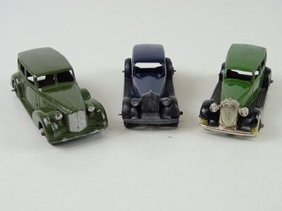 Lot 15 - A group of playworn early DINKY cars including...