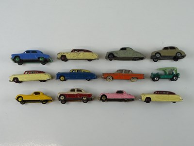 Lot 17 - A group of playworn early DINKY cars including...