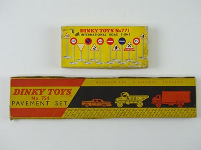 Lot 21 - A pair of DINKY accessory sets comprising a...