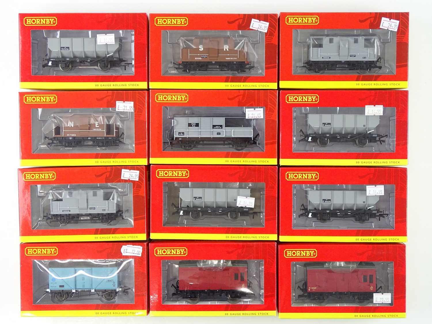 Lot 210 - A group of HORNBY OO gauge wagons including...