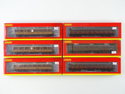 Lot 214 - A group of HORNBY OO gauge suburban and...