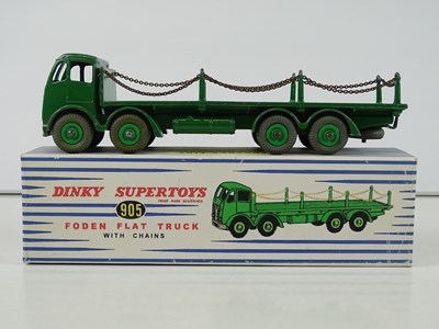 Lot 23 - A pair of DINKY Flat Trucks with chains...