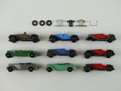 Lot 32 - A group of playworn early DINKY cars including...