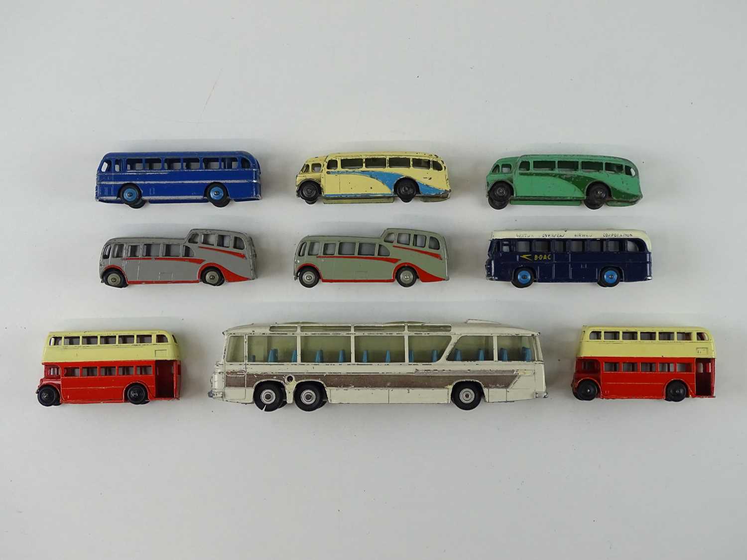 Lot 33 - A group of playworn DINKY buses and coaches -...