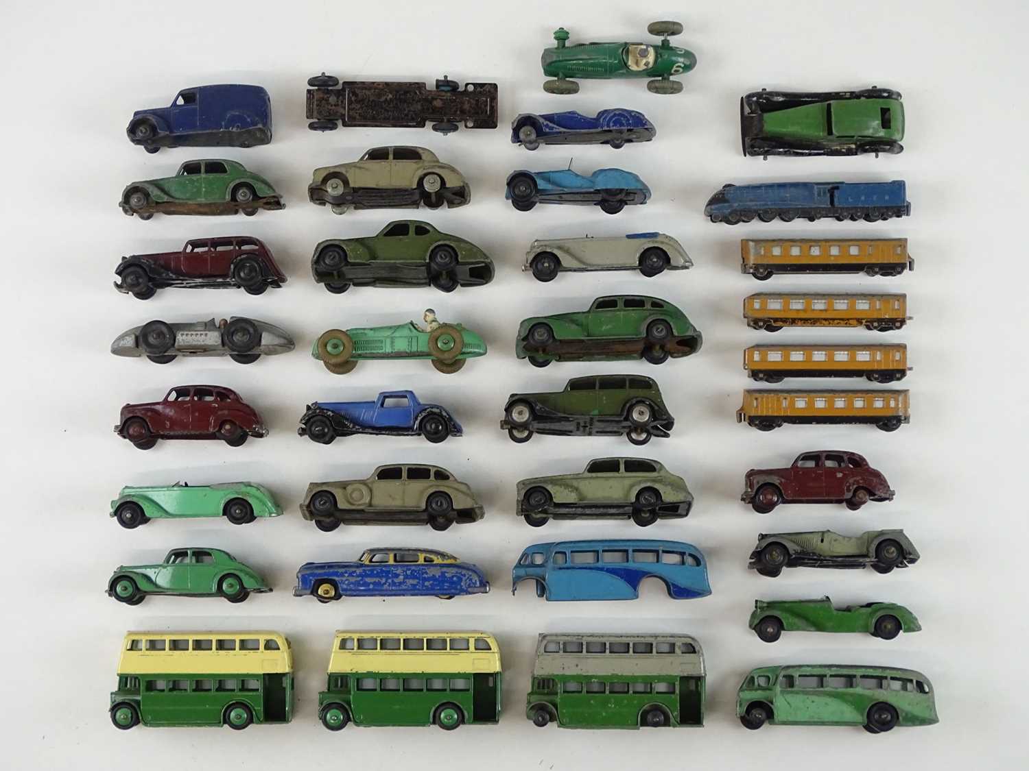 Lot 53 - A quantity of playworn early DINKY cars, buses...