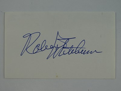 Lot 24 - A ROBERT MITCHUM signed 5 x 3 card - this has...