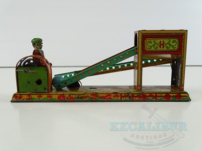 Lot 54 - A pair of early Japanese tinplate toys...