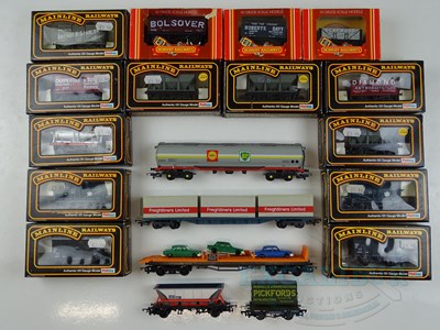 Lot 574 - A group mostly OO gauge wagons by HORNBY and...