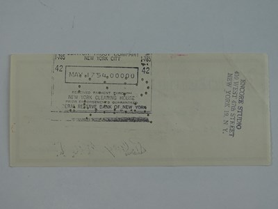 Lot 25 - A ROD STEIGER signed cheque dated May 7th 1954...