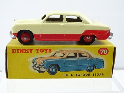 Lot 107 - A DINKY 170 Ford Fordor Sedan lowline cream /...