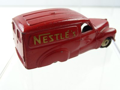 Lot 128 - A DINKY 471 Austin Van 'Nestles' rare cream...