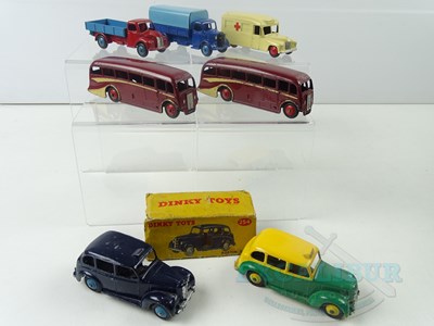 Lot 164 - A group of unboxed + 1 part boxed DINKY Toys,...