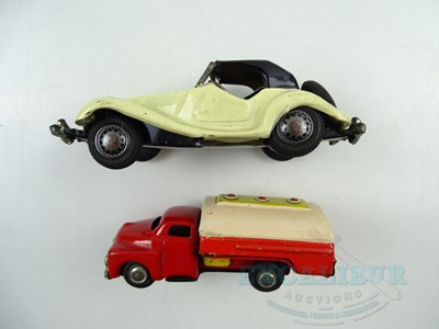 Lot 205 - A pair of unboxed Japanese tinplate friction...