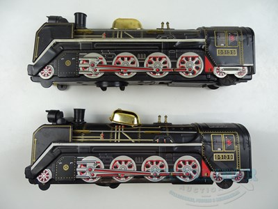 Lot 212 - A pair of MASUDAYA / MODERN TOYS Japanese tin...