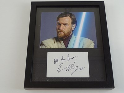 Lot 256 - STAR WARS: A framed and glazed display of EWAN...