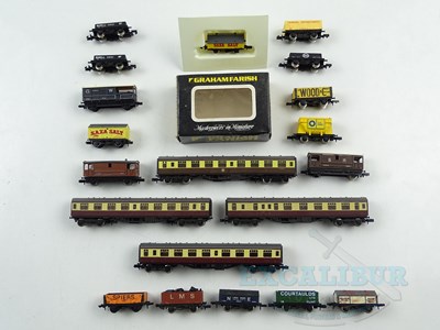 Lot 221 - A group of GRAHAM FARISH N gauge wagons and...