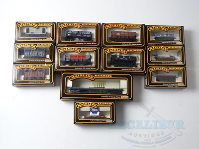 Lot 417 - A mixed group of MAINLINE OO gauge wagons as...