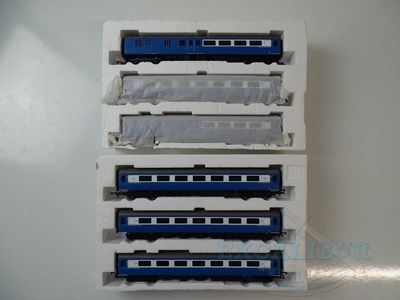 Lot 602 - A pair of OO gauge triple coach packs split...