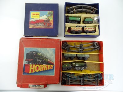 Lot 724 - A pair of HORNBY O gauge clockwork train sets -...