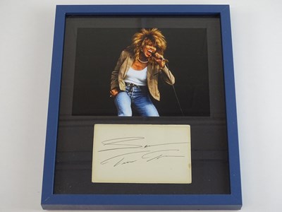 Lot 271 - TINA TURNER: A framed and glazed display...