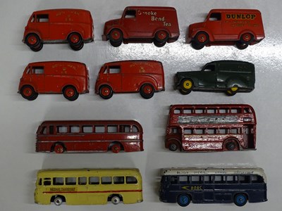 Lot 142 - A group of unboxed, playworn DINKY buses,...