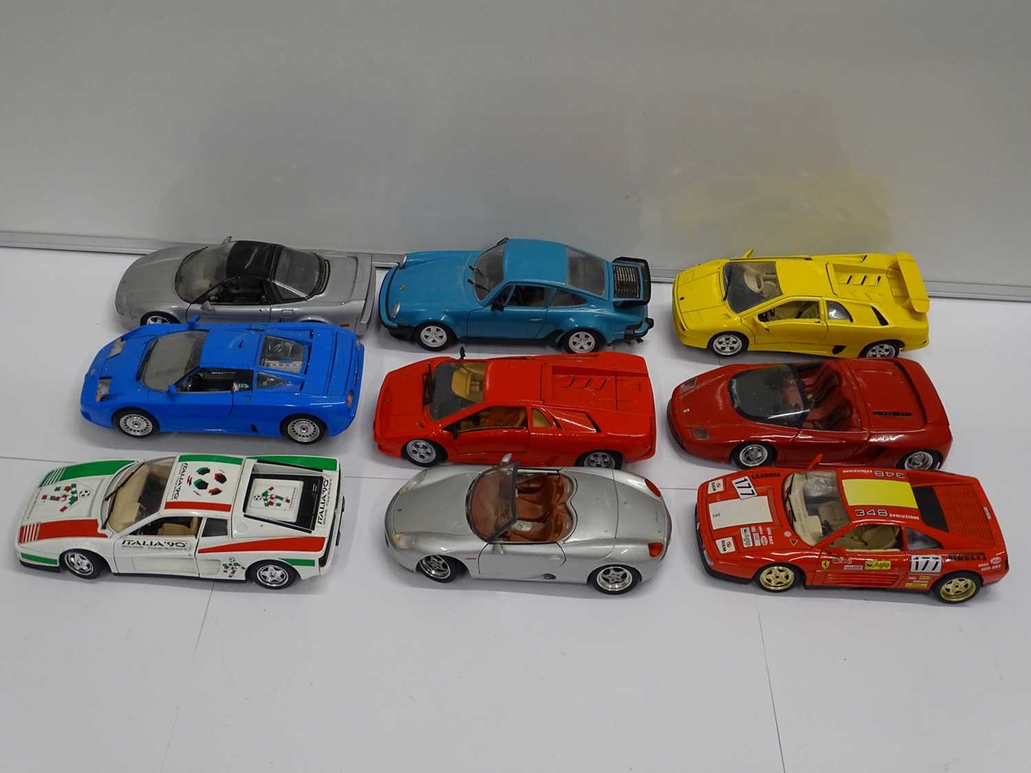 Lot 153 - A group of unboxed 1:18 scale diecast cars by...