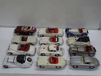 Lot 154 - A group of unboxed 1:18 scale diecast cars by...
