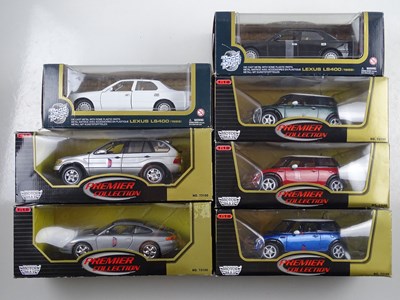 Lot 156 - A group of boxed 1:18 scale diecast cars by...