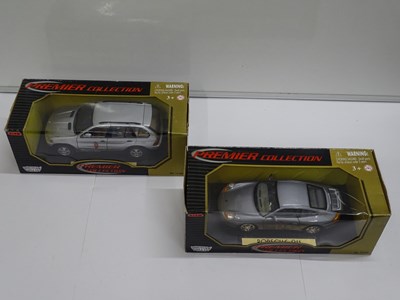 Lot 156 - A group of boxed 1:18 scale diecast cars by...